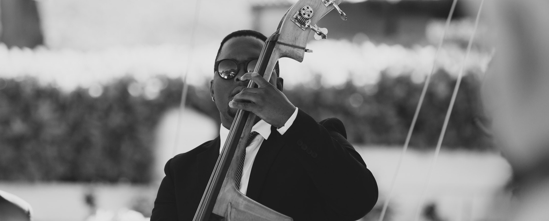 Double bass player performing at a ShoutMC corporate event